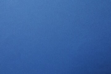 Naklejka premium Blue textured sheet background. Empty space for text.