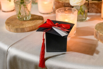 Graduation Celebration With Candles and Cap Decoration at Night