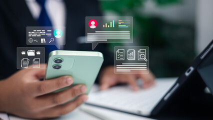 Businessman using smartphone and tablet with digital data analytics, online communication, and document management icons overlay for business technology concept