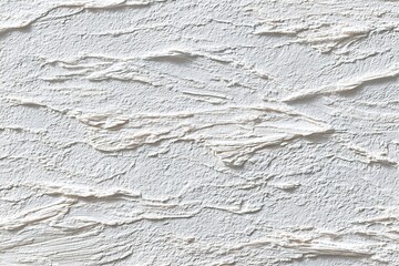 Fototapeta premium Textured white wall with layered plaster design showcasing artistic craftsmanship and modern interior style