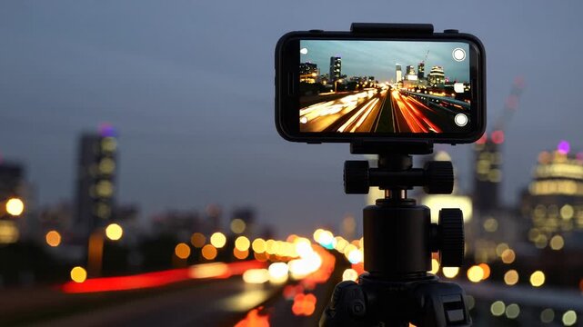 mobile device capturing urban scenery while mounted on stabilizing stand
