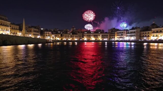 Fireworks Display Over Calm Bay Water Body at Night