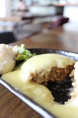 Hamburg steak with cheese sauce in Tokyo, Japan
