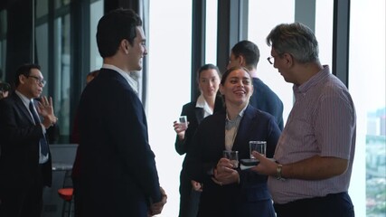 Business professionals networking and enjoying drinks at a corporate event in a modern office setting - Powered by Adobe