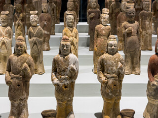 Terracotta or clay figurines of Han Dynasty in rows on display in Anyang Museum, Anyang, Henan, China. Heritage and tourist attraction.