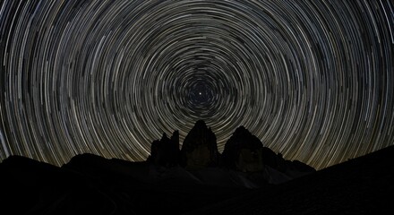 Fototapeta premium Star Trails Over Tre Cime di Lavaredo: A Night Sky Symphony