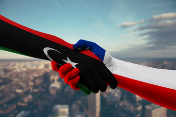 Shaking hands Libya and Chile