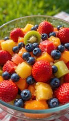 Obraz premium Delicious Summer Fruit Salad in a Glass Bowl