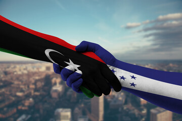 Shaking hands Libya and Honduras-2