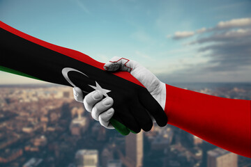 Shaking hands Libya and Malta