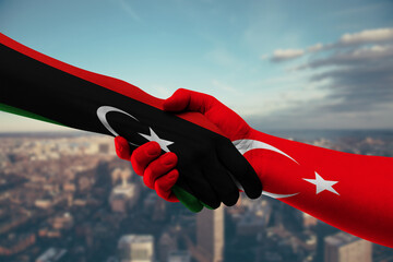 Shaking hands Libya and Turkey