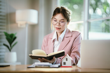 A woman hands over house keys with documents, symbolizing real estate contracts, property purchase, mortgage, investment, ownership, successful housing deals, and financial planning.