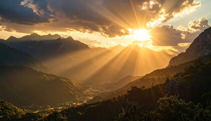 Fototapeta premium A breathtaking panoramic view of golden sunbeams radiating through clouds over a serene mountain valley at sunset