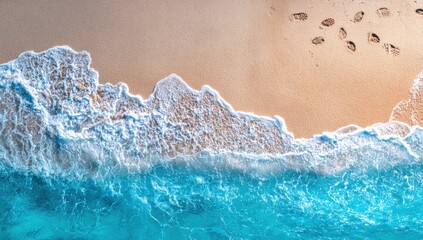 Aerial view of a pristine beach with foamy turquoise waves