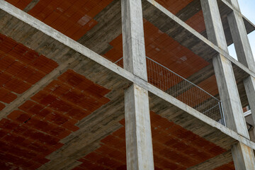 Construction details in reinforced concrete construction with exposed pillars and slabs. Architectural elements that define the basic structure of the building with floor connection points