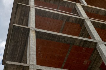 Construction details in reinforced concrete construction with exposed pillars and slabs. Architectural elements that define the basic structure of the building with floor connection points