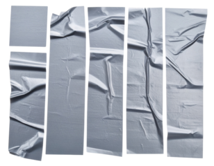 Seven torn, crumpled strips of masking tape with textured creases and uneven edges.