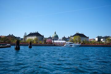 Scenic View of Copenhagen's Waterfront with Historic Architecture and Yacht - May 6, 2023