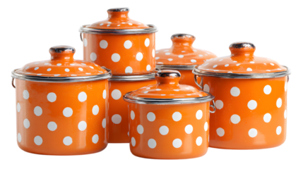 Cheerful orange enamel pots with playful polka dots bring a nostalgic, vintage charm to any farmhouse kitchen isolated on white background