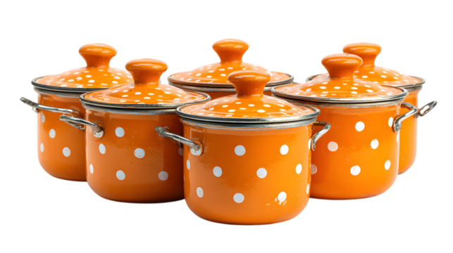 Stylish orange enamel pots with white dots set, ready for cooking delicious meals at home anytime isolated on white background