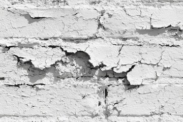 Obraz premium Cracked whitewashed brick wall