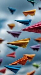 Colorful paper airplanes in flight