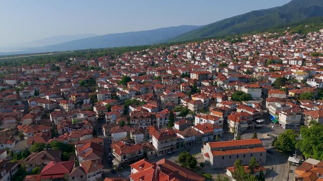 Aerial Drone Shot Flying Over Litochoro Town Center In Pieria, Greece At Early Morning.