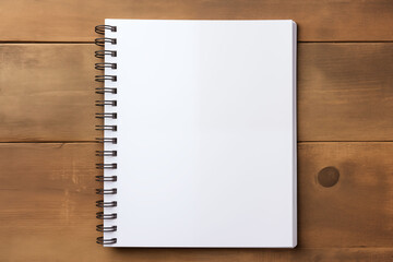 White spiral notebook on wooden texture background