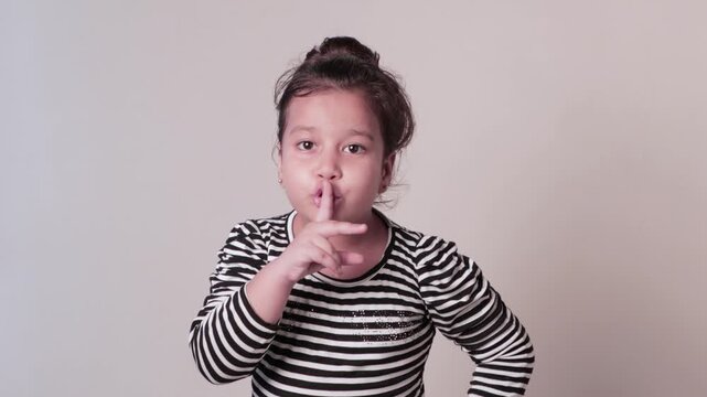 Indian Girl Gesturing Silence &mdash; Keep Quiet Expression