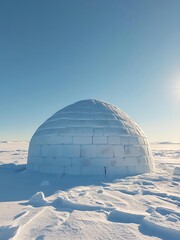 Obraz premium Traditional Igloo Made of Snow Blocks in Winter Landscape
