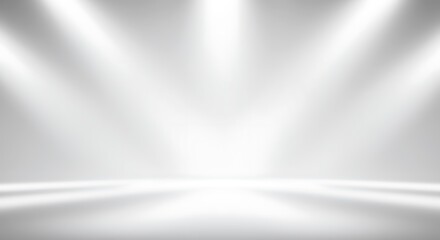Abstract white and gray gradient background with soft spotlights shining down, creating a bright and clean studio effect.