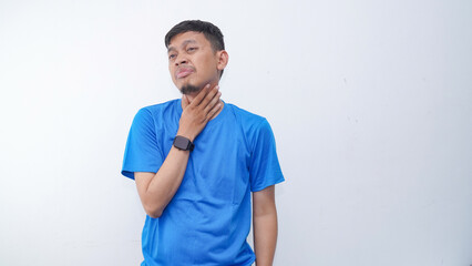 Asian young man touching his throat showing in pain expression