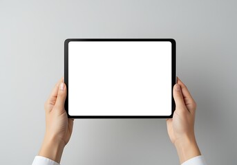 Hands Holding a Blank White Screen Tablet Device Mockup for App Promotion or Website Display on Neutral Gray Background