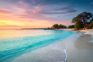 Idyllic tropical beach with turquoise water and white sand under a vibrant pastel sunset.