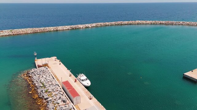 Aerial Drone Shot Of Platamon Harbor And Clear Turquoise Aegean Sea In Pieria, Central Macedonia, Greece On A Sunny Summer Afternoon.