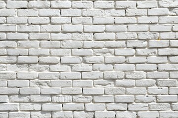 Obraz premium A weathered white brick wall with visible texture and mortar, providing a rustic and industrial background or surface
