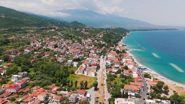 Aerial Drone Shot Flying Over The Aegean Sea Towards Platamon Coastal Town, Pieria, Greece, On A Sunny Summer Afternoon.