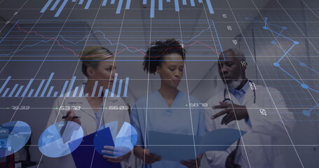 Medical team in lab coats reviewing documents in hospital corridor, with clipboard data charts