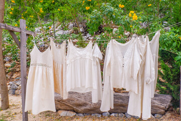 Different clothes drying on laundry line against garden background,clothes hanging laundry on washing line for drying towels drying on the clothesline.