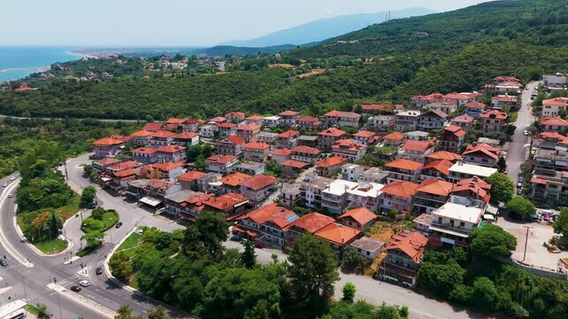 Aerial Drone Shot of Coastal Residential Area in Platamon, Pieria, Greece on a Sunny Summer Afternoon.