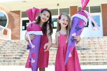 Happy children girlfriend schoolgirl student elementary school, - Cone Education kids. First day of school