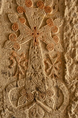 ancient pattern on the stone wall of the Geghard temple, Armenia