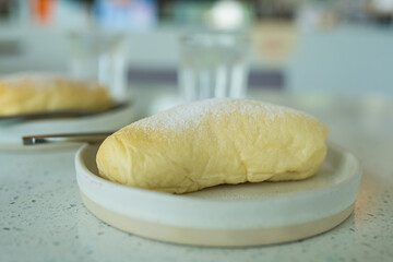 Delicious cream filled buns with powdered sugar. Close up