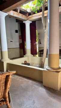 Classical Roman Atrium Interior with Impluvium Pool and White Columns: Authentic Historical Reconstruction of an Ancient Domus Courtyard with Natural Sky Lighting