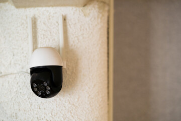 Home Security Camera Mounted on Wall
