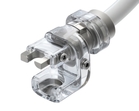 Close-up of a medical or industrial connector, featuring a clear plastic housing surrounding a metallic mechanism.  A section of a tube or pipe is visible.  Precise engineering is evident