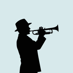 Silhouette of a person playing a trumpet against a light blue background.