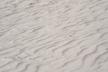 Photo of a sand pattern on the sea coast in close-up