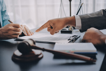 Lawyer explained to the client about the law that must be brought against the court case.