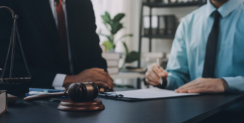 Lawyer explained to the client about the law that must be brought against the court case.
